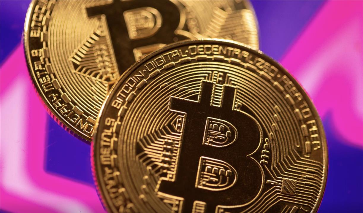 Bitcoin hits record high above $62,000